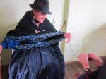 senior lady spinning wool